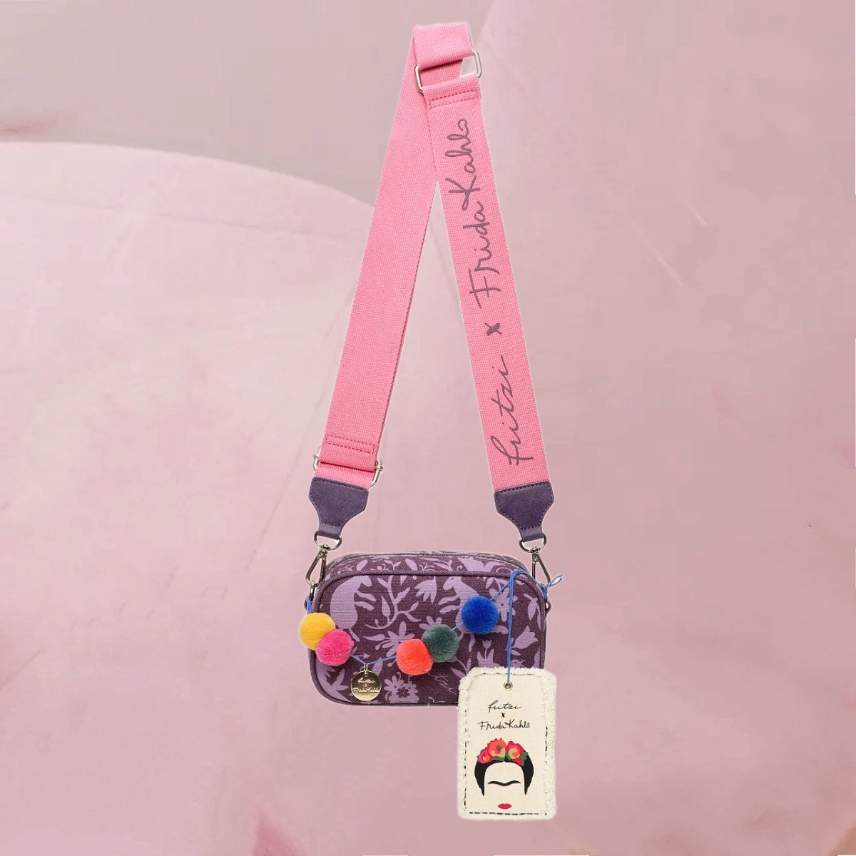 Hübsche Schultertasche "Fritzi x Frida Kahlo Easy Go" in Lila mit bunten Pompons von fritzi